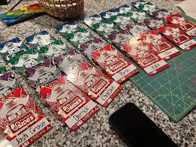 BSides Tampa 2024 badges laid out on a table