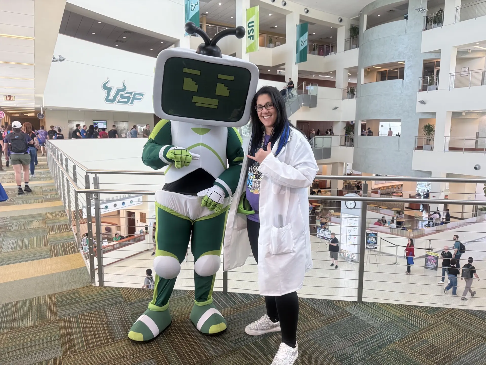 Krewe member with the USF Rocky mascot
