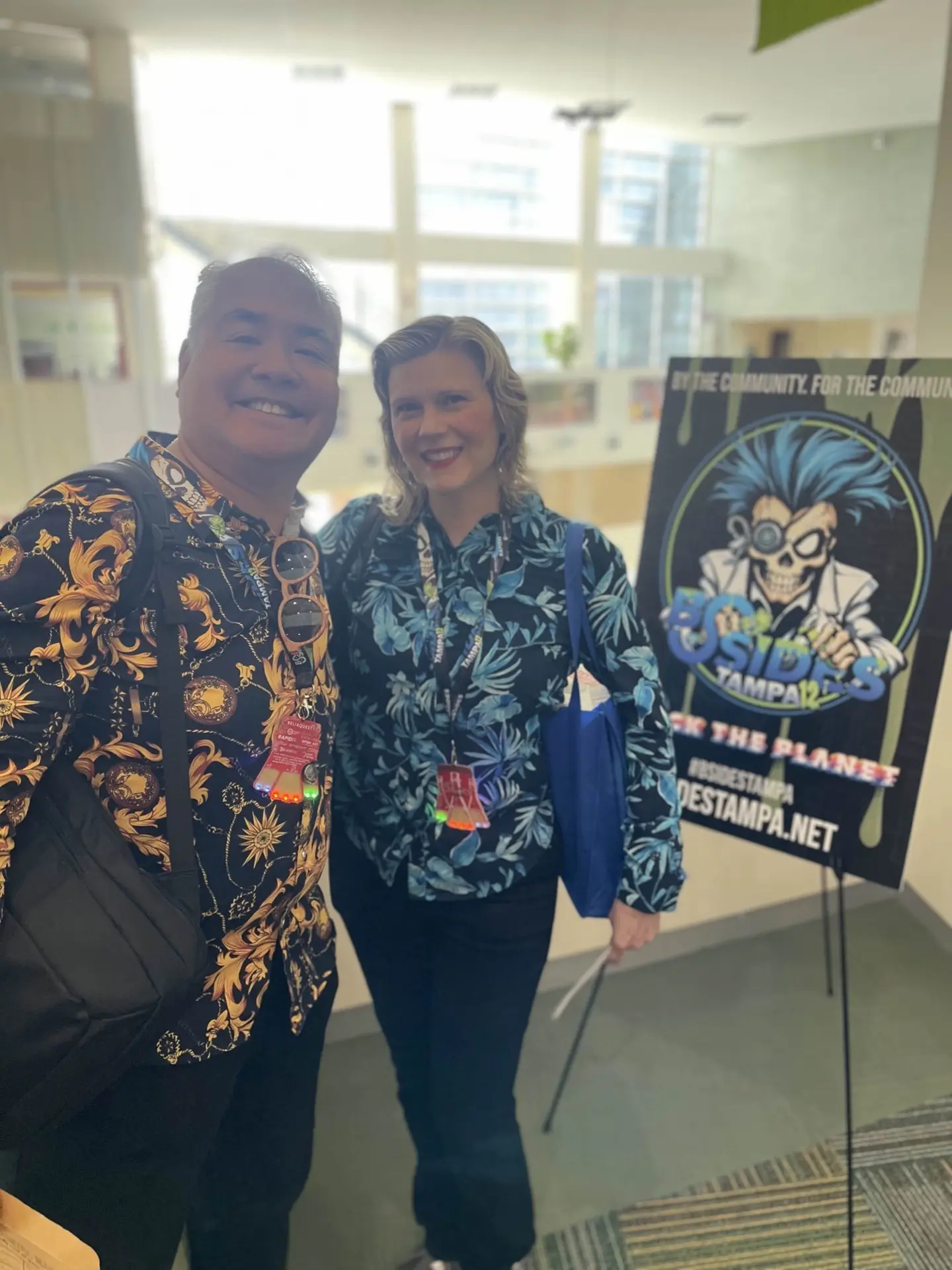 Participants posing with BSides Tampa signage
