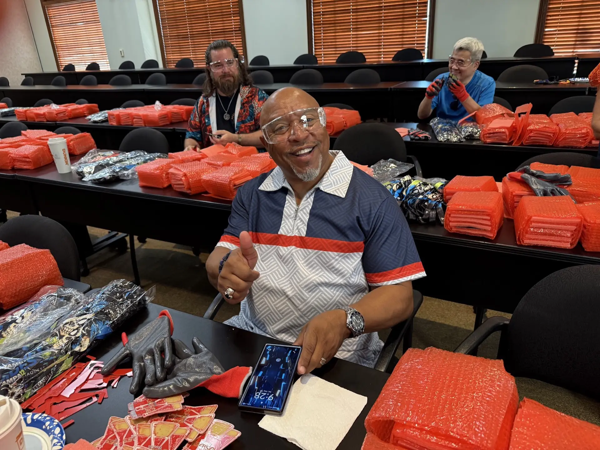 Krewe member smiling while packing swag