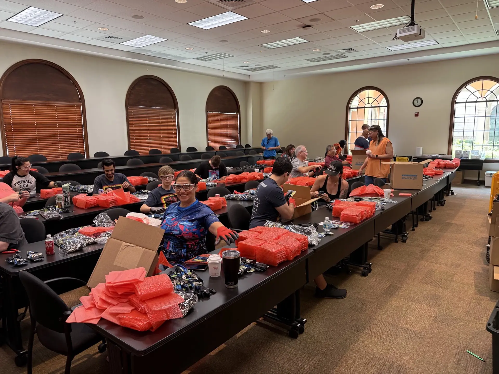 Krewe members packing swag bags for BSides Tampa