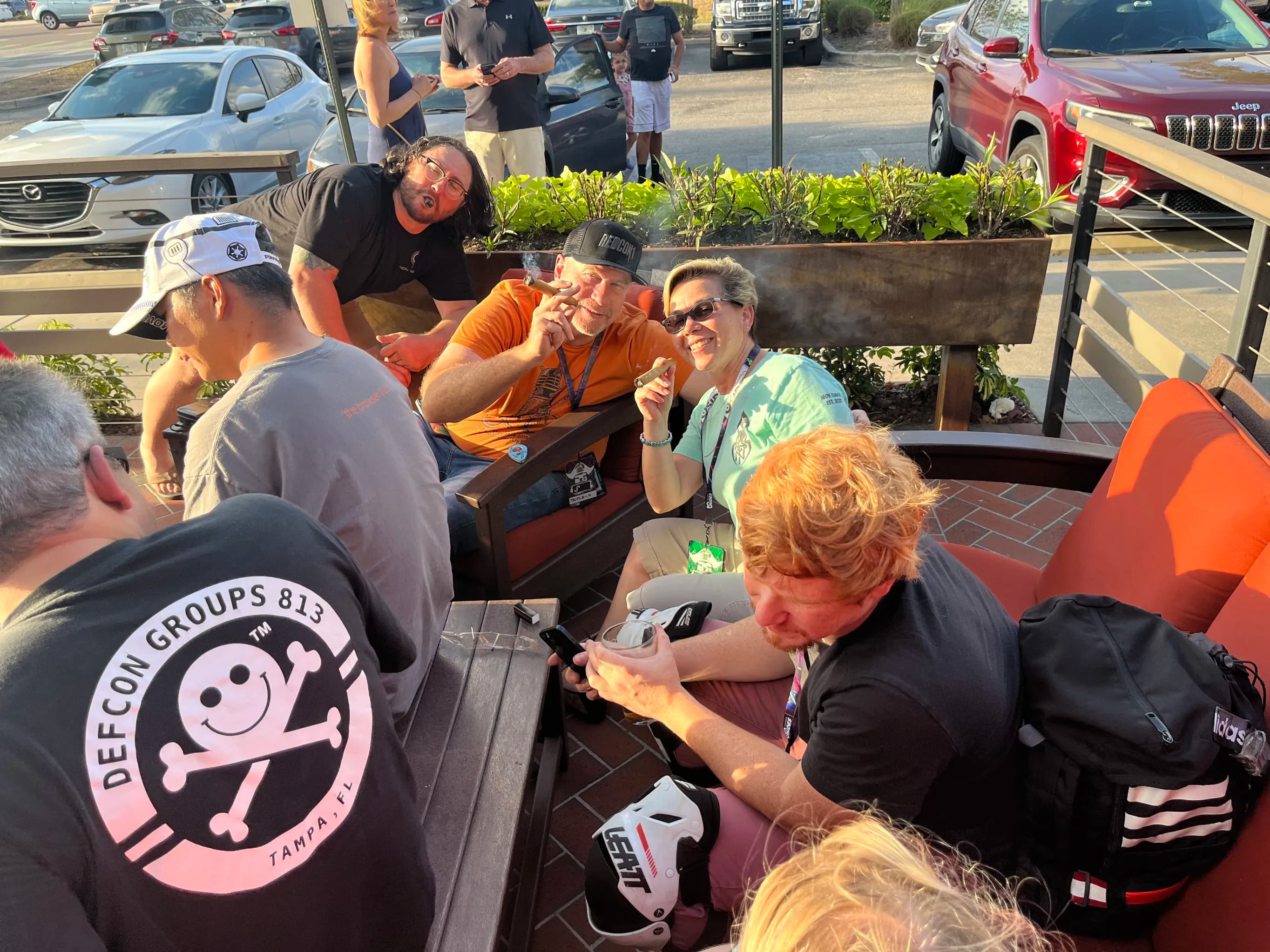 A small group of BSides Tampa participants chatting on the patio at Happy Hour