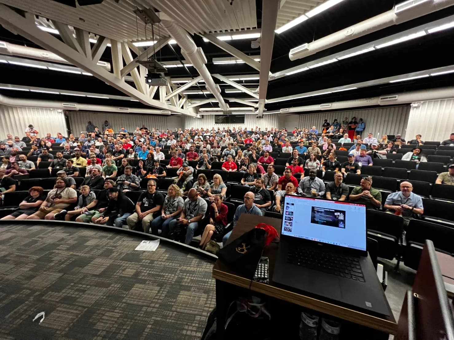 Main auditorium filled with participants during a keynote
