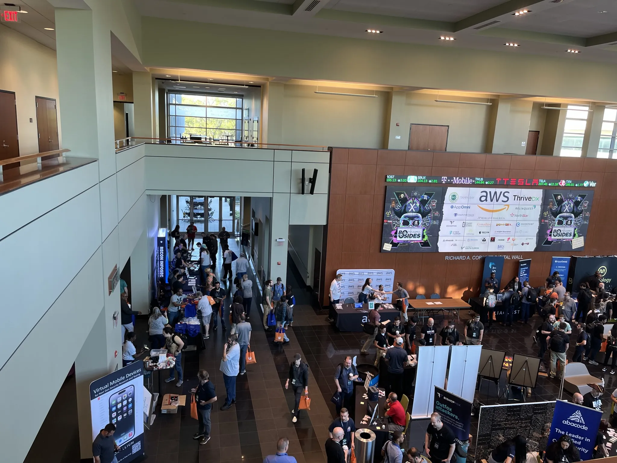 Expo hall with sponsor booths and attendees